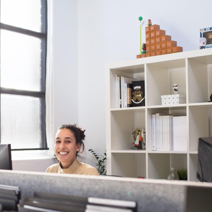 Woman at office desk smiling Woman at office desk smiling