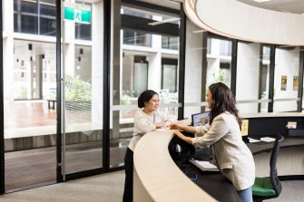 Female student asking questions at Student Services