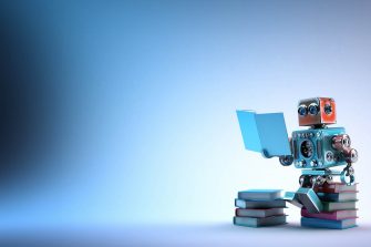 Robot sitting on a bunch of books. Contains clipping path