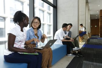 Group of students studying at L5 with laptops