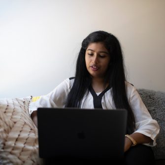 Student studying in bedroom at accommodation