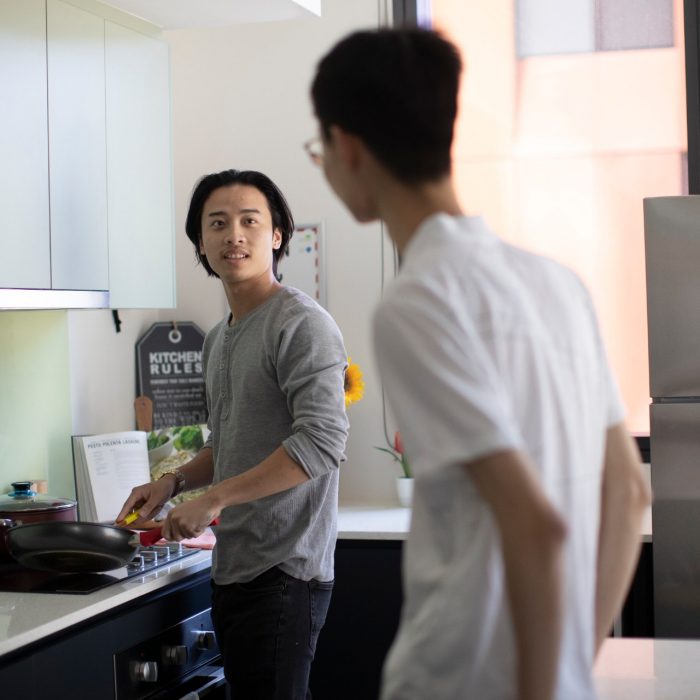 Student accommodation Students cooking in kitchen of student accommodation