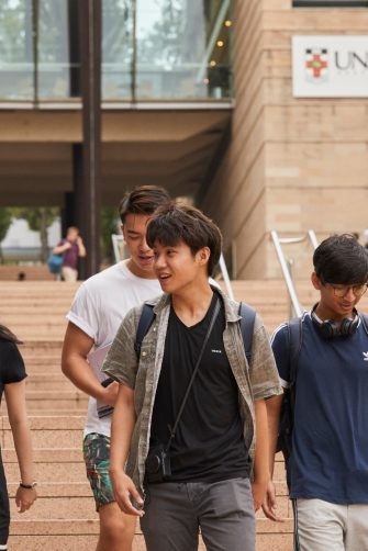 Students on walking down steps on campus