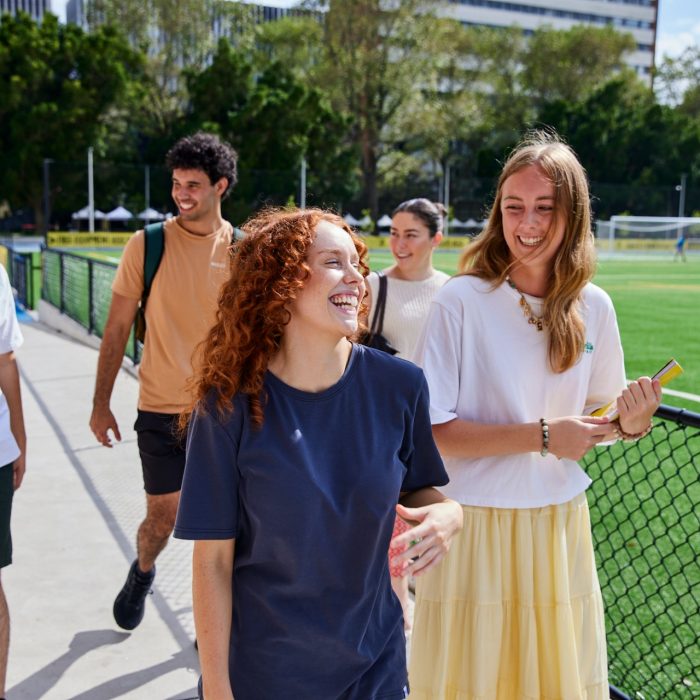 UNSW College Students near Village Green. Walking and talking.