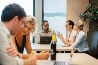 Two groups of people are working