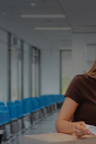 Applied Degrees Student at front desk