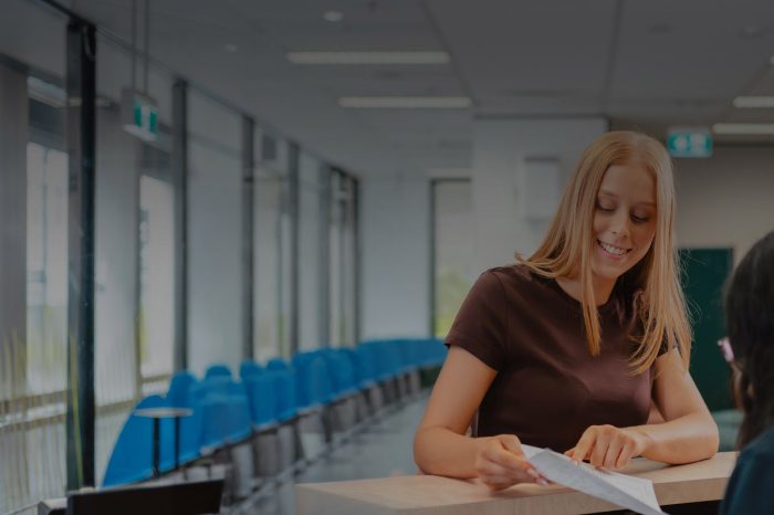 Applied Degrees Student at front desk
