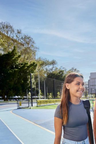 UNSW College Students on Main Campus walking near sports oval