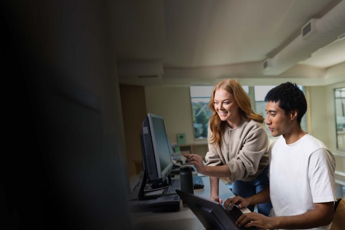 Applied Degree students working together on computers