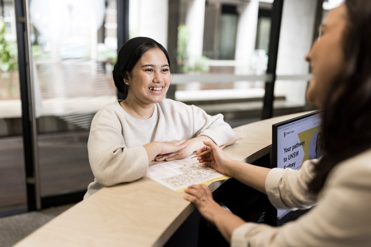 Students talking to Student Services staff