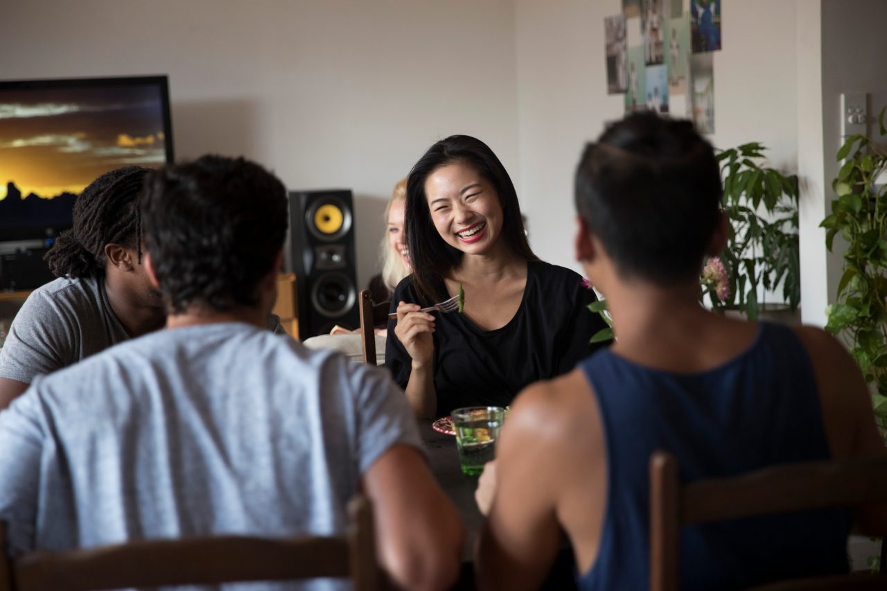 Students eating at the dinner table in accommodation