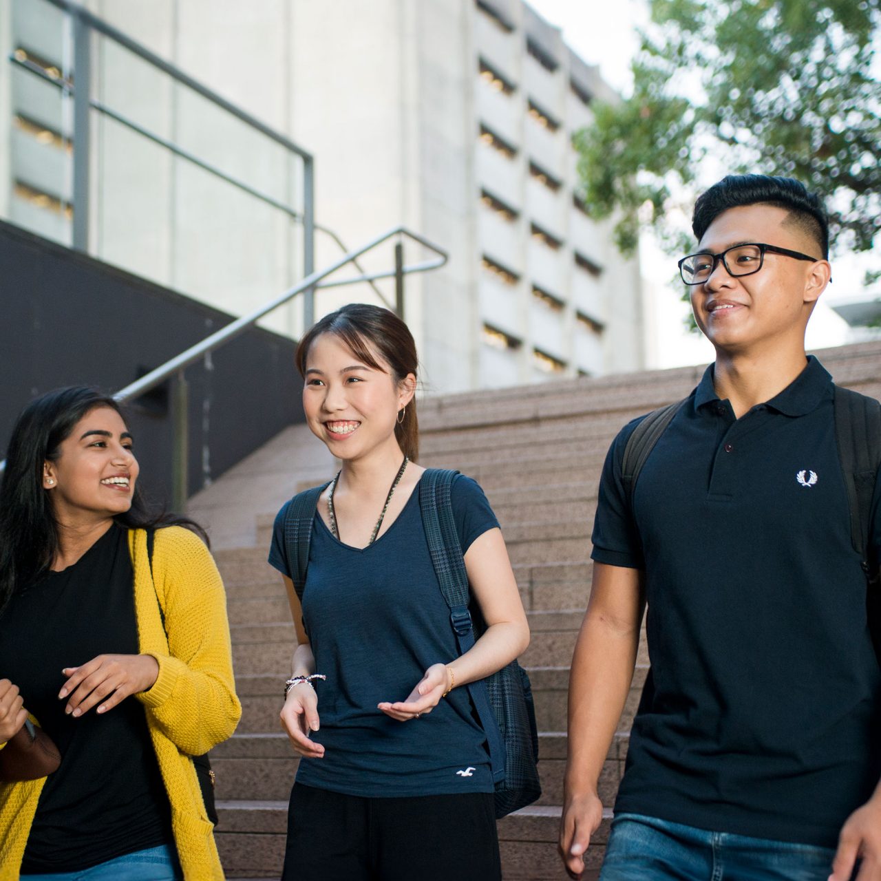 Photo of three students walking around campus