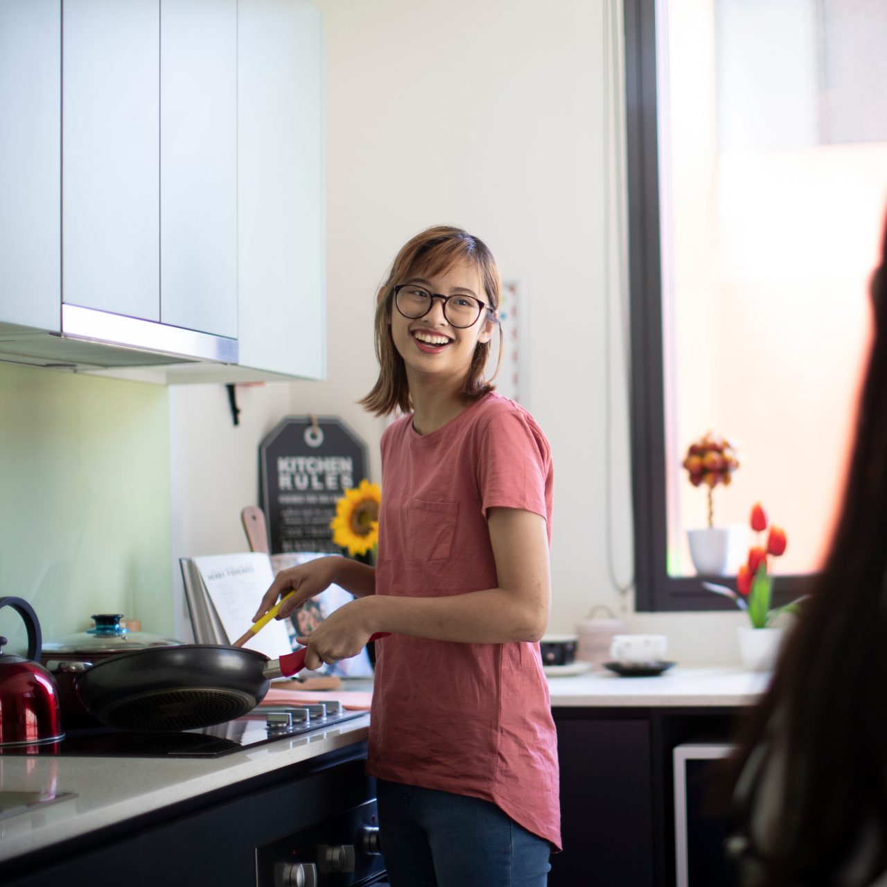 Students cooking in kitchen of student accommodation