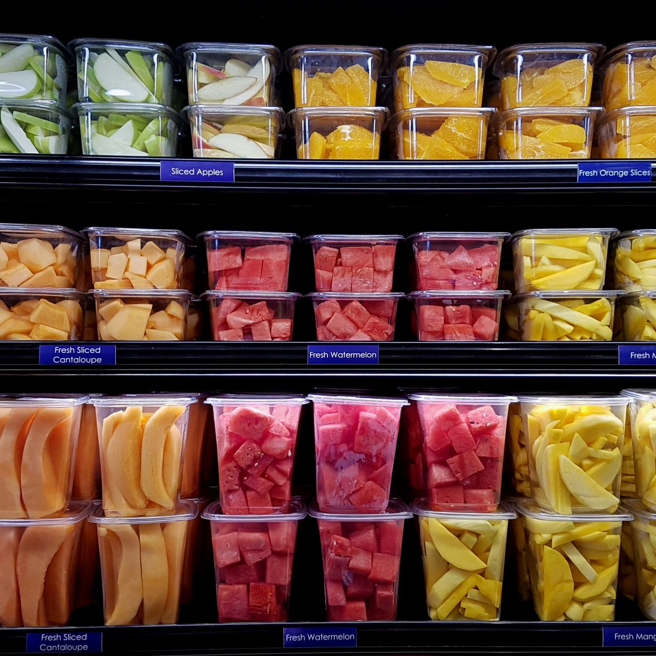 Fresh cut fruit in plastic containers in local supermarket