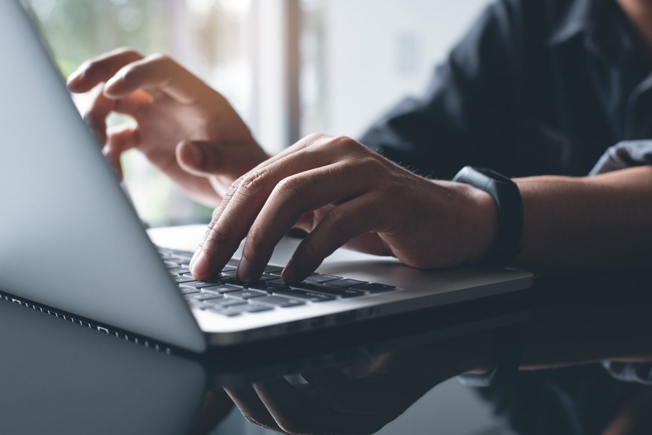Photo of a person working on laptop computer