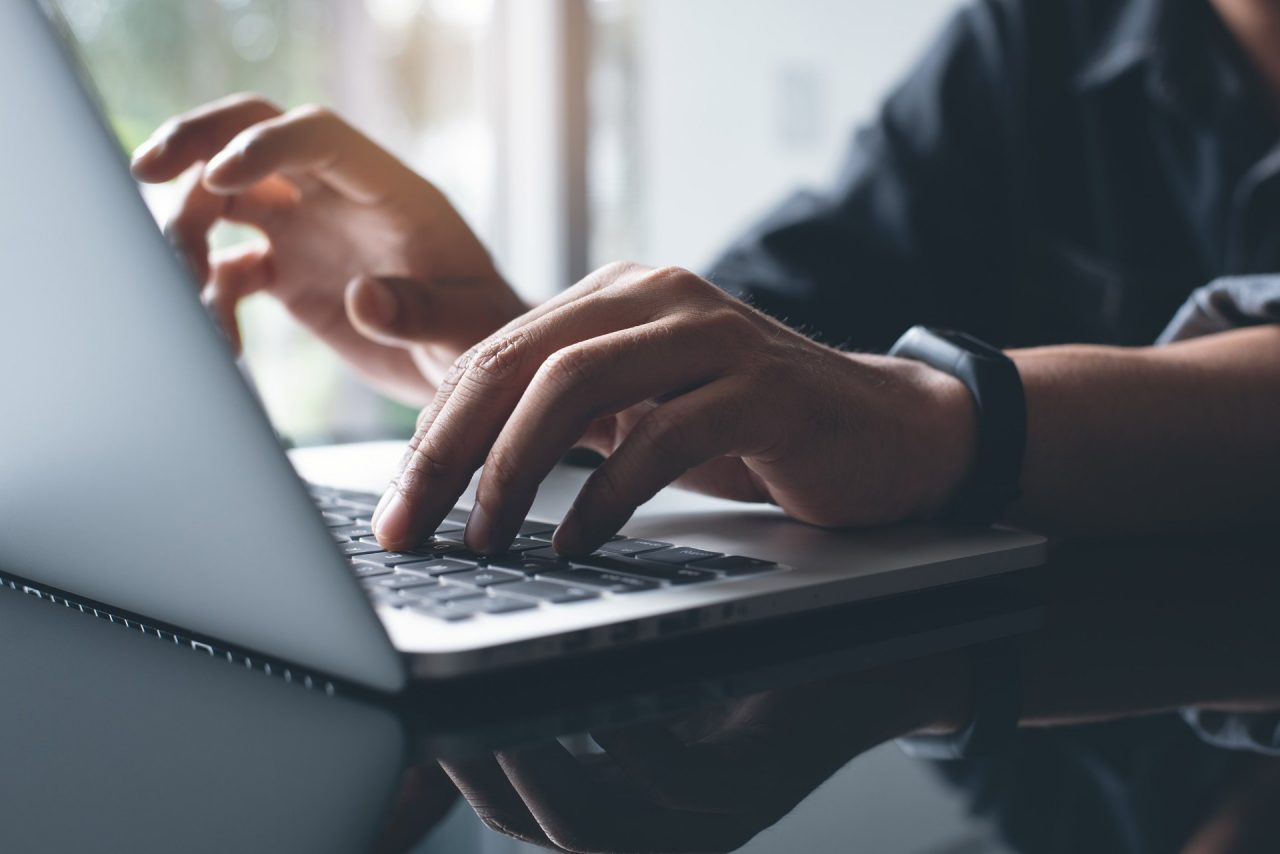 Photo of a person working on laptop computer