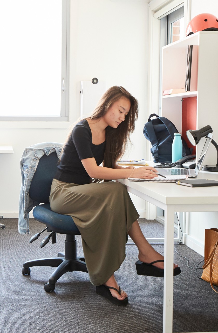 Student studying at the desk in their student accommodation