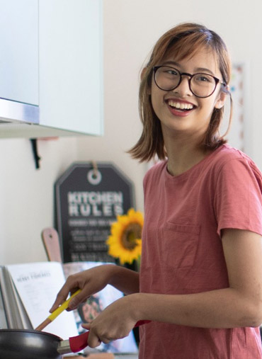 Student cooking in accommodation