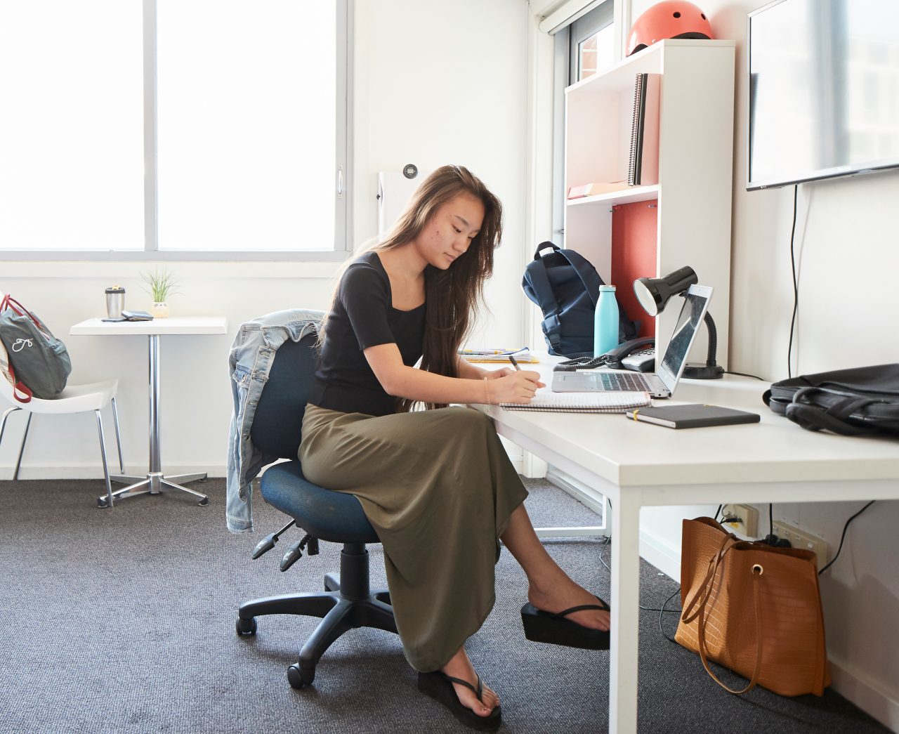 Student studying at the desk in their student accommodation